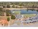 Scenic aerial view of golf course, lake, and clubhouse with ample parking at 179 Country Club Dr, Hiram, GA 30141