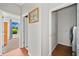 Hallway with bedroom to left and laundry room to right at 179 Country Club Dr, Hiram, GA 30141