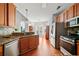 Traditional kitchen with stainless steel appliances, granite countertops and cherry wood cabinetry at 179 Country Club Dr, Hiram, GA 30141