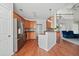 Spacious kitchen featuring stainless steel appliances, wooden cabinets, and an island with granite countertops at 179 Country Club Dr, Hiram, GA 30141