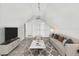 Cozy living room with modern lighting, plush sofa, stylish rug, and contemporary decor at 179 Country Club Dr, Hiram, GA 30141