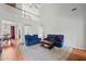 Bright living room with hardwood floors and ample seating at 179 Country Club Dr, Hiram, GA 30141
