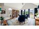 Bright sitting area with vaulted ceilings and ample windows at 179 Country Club Dr, Hiram, GA 30141