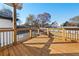 This outdoor deck offers ample space for relaxing and entertaining, set against a backdrop of lush trees at 2018 Presley Ne Way, Atlanta, GA 30317