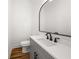Stylish powder room featuring gray vanity and a sleek mirror at 2018 Presley Ne Way, Atlanta, GA 30317