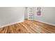 Empty bedroom with hardwood floors, white trim, and a modern interior door at 2018 Presley Ne Way, Atlanta, GA 30317
