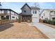 Two-story home with a two-tone exterior and modern design features at 2018 Presley Ne Way, Atlanta, GA 30317