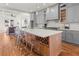Spacious kitchen featuring gray cabinets, a large island, and modern lighting at 2018 Presley Ne Way, Atlanta, GA 30317