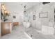 This main bathroom with marble and a glass shower offers a spa-like experience at 2018 Presley Ne Way, Atlanta, GA 30317