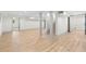 Spacious basement featuring durable wood flooring, white walls, and plenty of natural light at 3216 Woodview Se Dr, Smyrna, GA 30082