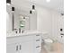 Bathroom featuring a modern vanity, toilet, shower and light fixtures at 3216 Woodview Se Dr, Smyrna, GA 30082