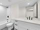 Bright bathroom featuring a tiled shower, modern vanity, and sleek black fixtures at 3216 Woodview Se Dr, Smyrna, GA 30082