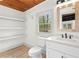 Bright bathroom with new vanity, open shelves, and modern fixtures at 3216 Woodview Se Dr, Smyrna, GA 30082