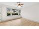 Bedroom with new hardwood floors, neutral paint, and a view of the front yard at 3216 Woodview Se Dr, Smyrna, GA 30082