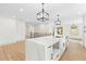 Bright kitchen with marble island, designer lighting and plenty of counter space for cooking at 3216 Woodview Se Dr, Smyrna, GA 30082
