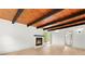 Living room featuring a fireplace, modern flooring, and a wood ceiling at 3216 Woodview Se Dr, Smyrna, GA 30082