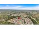 A charming neighborhood is shown in an aerial view on a clear day, surrounded by mature trees at 709 Mountain Laurel Dr, Canton, GA 30114