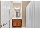 Bathroom featuring a vanity with a wood cabinet, a toilet, and a shower with a curtain at 709 Mountain Laurel Dr, Canton, GA 30114
