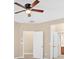 Bedroom featuring a ceiling fan, carpet, and a doorway leading to a bathroom at 709 Mountain Laurel Dr, Canton, GA 30114