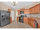 Modern kitchen featuring wood cabinets, stainless steel appliances, and ample counter space at 709 Mountain Laurel Dr, Canton, GA 30114