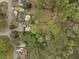 Aerial view of the neighborhood showcasing the mature trees and the backyard swimming pools at 1068 Gwens Sw Trl, Lilburn, GA 30047