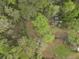 Lush aerial view highlighting the lot's wooded surroundings and potential privacy at 1068 Gwens Sw Trl, Lilburn, GA 30047