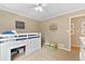 A bedroom featuring a lofted bed with built-in storage and natural light at 1068 Gwens Sw Trl, Lilburn, GA 30047