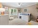 Inviting bedroom with bright window and a unique lofted bed, perfect for a space at 1068 Gwens Sw Trl, Lilburn, GA 30047