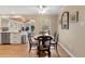 Bright breakfast nook with a small table and view into the backyard at 1068 Gwens Sw Trl, Lilburn, GA 30047