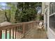 Back deck overlooking the pool area with two chairs offering a peaceful outdoor retreat at 1068 Gwens Sw Trl, Lilburn, GA 30047