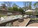 Outdoor deck with wicker furniture and colorful pillows perfect for entertaining and enjoying the outdoors at 1068 Gwens Sw Trl, Lilburn, GA 30047