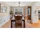 Elegant dining room with a wooden table, stylish chairs, and natural lighting at 1068 Gwens Sw Trl, Lilburn, GA 30047
