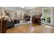 Inviting living room with hardwood floors, a classic desk, and comfortable seating at 1068 Gwens Sw Trl, Lilburn, GA 30047