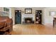 Inviting living room with a fireplace, hardwood floors, and built-in bookcases at 1068 Gwens Sw Trl, Lilburn, GA 30047