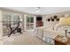Sunlit main bedroom with a Peloton bike, walk out deck and a neutral color palette at 1068 Gwens Sw Trl, Lilburn, GA 30047