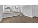 Open basement showcasing a stairway to the kitchen, a doorway, and light-colored wood flooring at 1449 Hoy Taylor Dr, Norcross, GA 30093