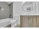 Clean bathroom with a modern vanity, updated light fixtures, and a tiled shower and tub combo at 1449 Hoy Taylor Dr, Norcross, GA 30093
