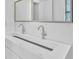 Close up on a modern bathroom featuring a double sink vanity with sleek chrome fixtures at 1449 Hoy Taylor Dr, Norcross, GA 30093