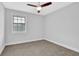 Cozy bedroom showcasing a ceiling fan and a window offering lots of natural light at 1449 Hoy Taylor Dr, Norcross, GA 30093