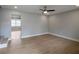 Open living room with hardwood floors, light gray walls, and recessed lights at 1449 Hoy Taylor Dr, Norcross, GA 30093