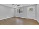 Bright living room with a ceiling fan, recessed lights, and hardwood floors at 1449 Hoy Taylor Dr, Norcross, GA 30093