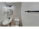 Stylish half-bathroom with a modern vanity, round mirror, contemporary lighting, and updated fixtures at 4480 Maple Valley Dr, Cumming, GA 30040