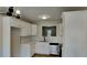 Modern kitchen with white cabinets, stainless steel appliances, subway tile backsplash, and recessed lighting at 4480 Maple Valley Dr, Cumming, GA 30040