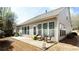 Inviting backyard patio with comfortable seating, ideal for outdoor relaxation and entertaining at 4520 Vanadium Bnd, Cumming, GA 30040