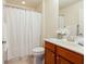 Full bathroom with a shower-tub, vanity, and tile floors provides a comfortable and functional space at 4520 Vanadium Bnd, Cumming, GA 30040