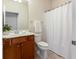 Bathroom with vanity, tile floors and shower with shower curtain at 4520 Vanadium Bnd, Cumming, GA 30040