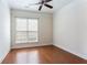 Bedroom with hardwood floors and ceiling fan at 4520 Vanadium Bnd, Cumming, GA 30040
