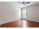 Bedroom with natural light, ceiling fan, and hardwood floors at 4520 Vanadium Bnd, Cumming, GA 30040