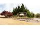 Welcoming Fieldstone Park entrance with lush landscaping, stone signage, and manicured lawn at 4520 Vanadium Bnd, Cumming, GA 30040