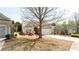 Well-manicured home with a two-car garage and a driveway with landscaping at 4520 Vanadium Bnd, Cumming, GA 30040